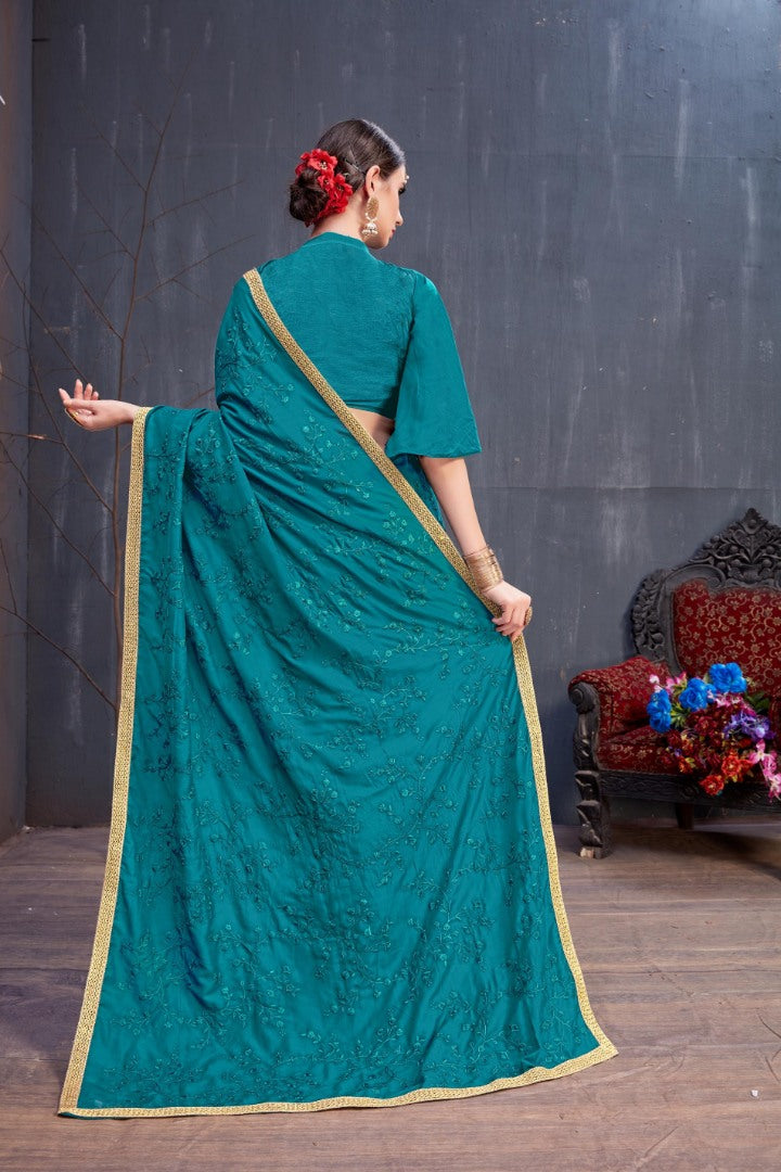 Designer teal blue embroidered partywear saree
