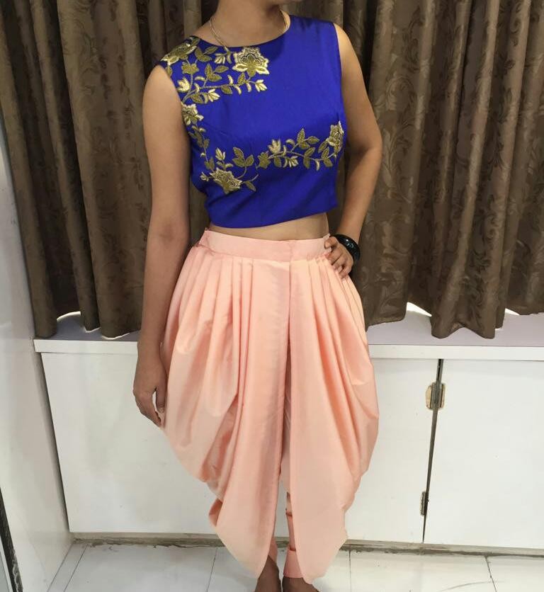 Fabulous peach dhoti and blue embroidered top suit