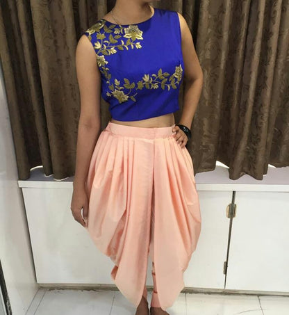 Fabulous peach dhoti and blue embroidered top suit