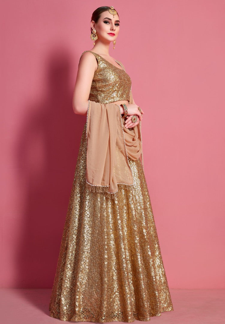 Gold soft net embroidered party wear lehenga choli