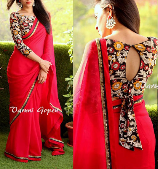 Gorgeous red partywear saree with fancy blouse