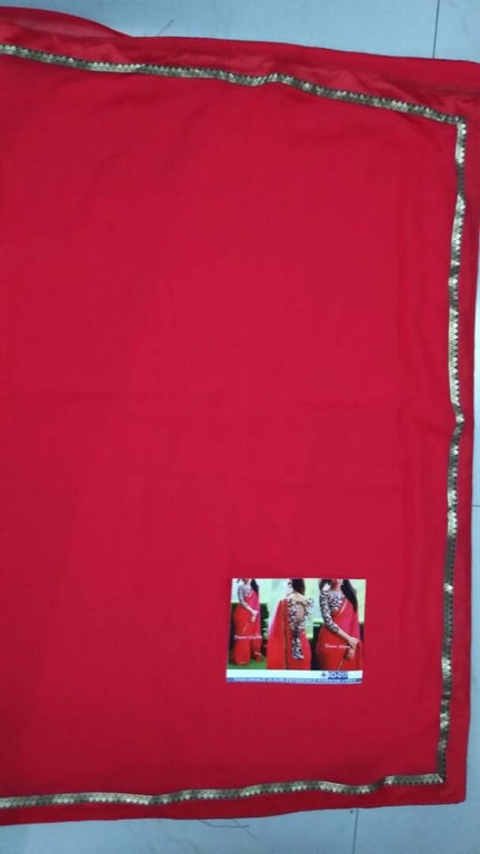 Gorgeous red partywear saree with fancy blouse