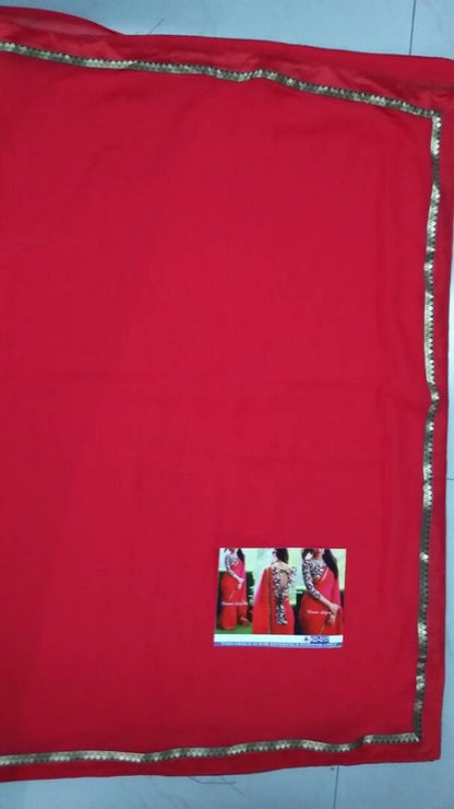 Gorgeous red partywear saree with fancy blouse