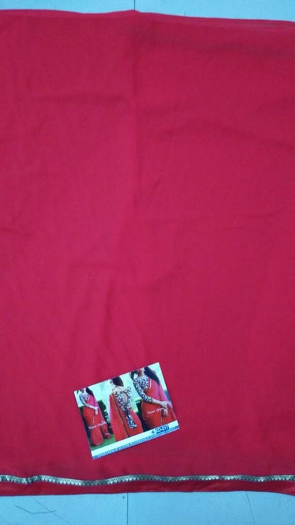 Gorgeous red partywear saree with fancy blouse
