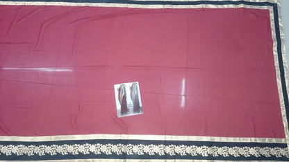 Gorgeous red saree with black embroidered lace