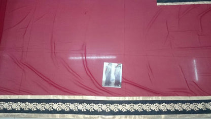 Gorgeous red saree with black embroidered lace