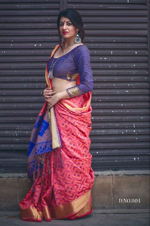 Gorgeous salmon pink patola silk saree with contrast blouse