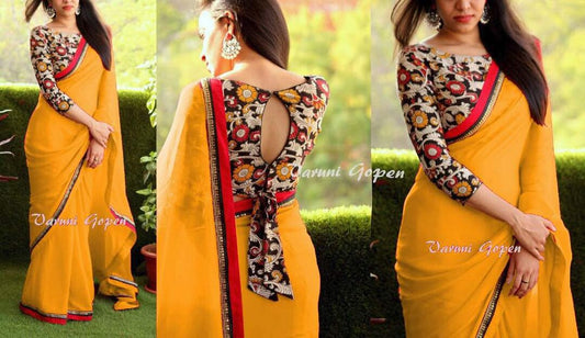 Gorgeous yellow partywear saree with fancy blouse