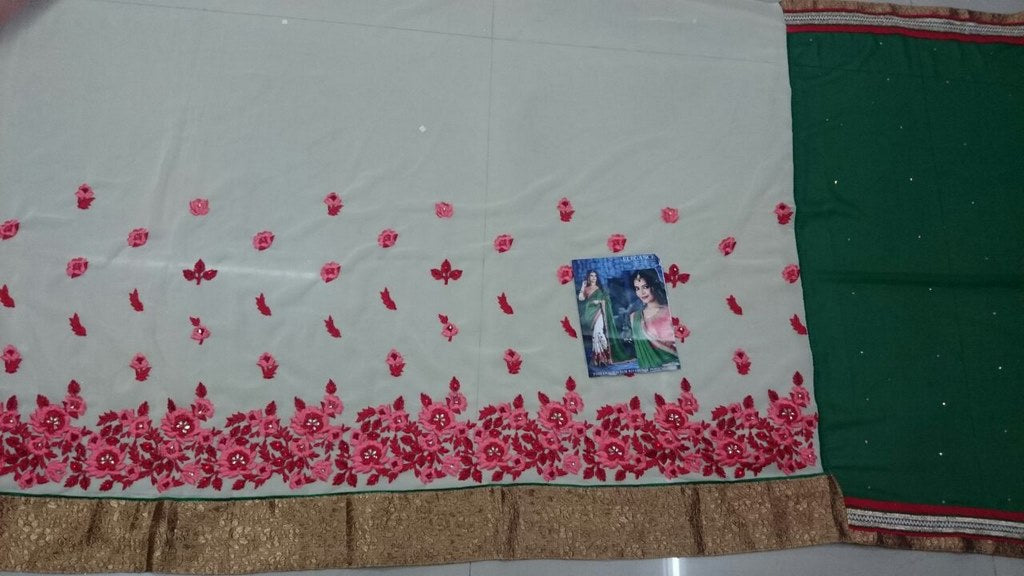 Green and white embroidered wedding saree