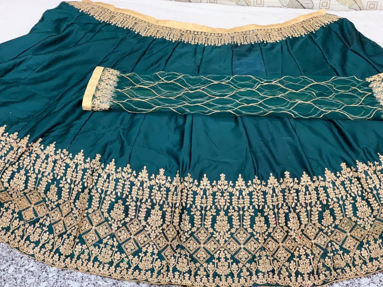 Green goldy silk heavy embroidered designer wedding lehengha
