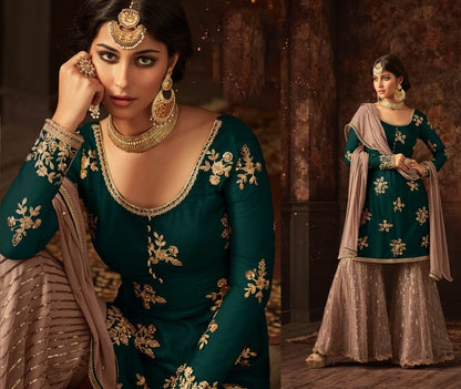 Green heavy embroidered and stone work sharara salwar suit