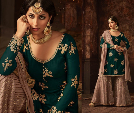 Green heavy embroidered and stone work sharara salwar suit