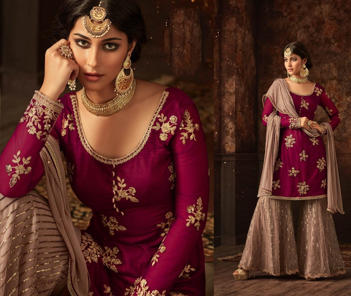 Green heavy embroidered and stone work sharara salwar suit