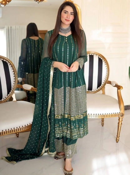 Green heavy embroidery worked salwar suit with shrug