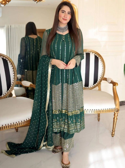 Green heavy embroidery worked salwar suit with shrug
