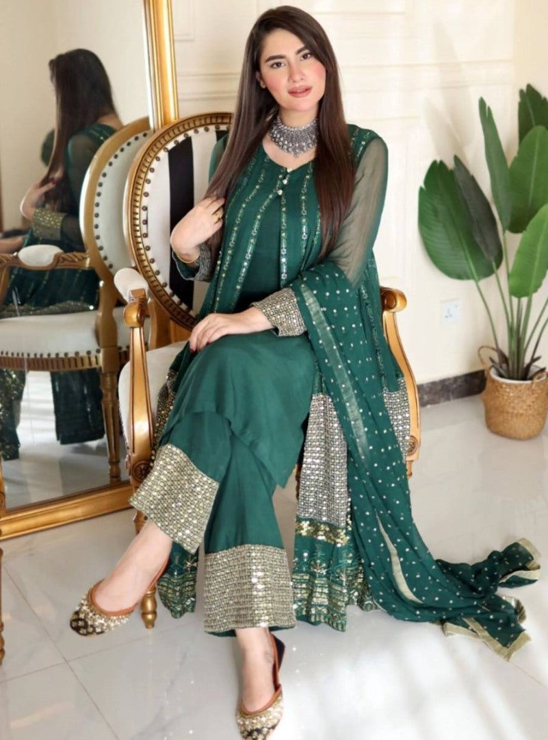 Green heavy embroidery worked salwar suit with shrug