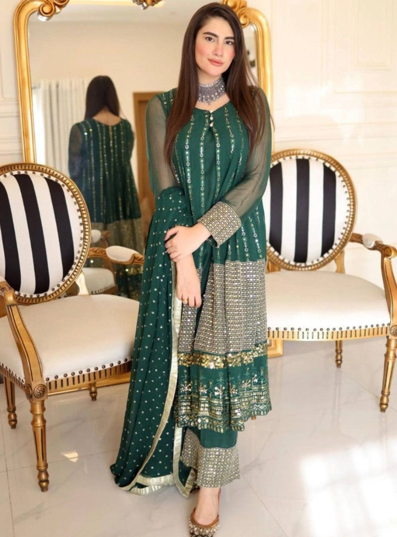 Green heavy embroidery worked salwar suit with shrug