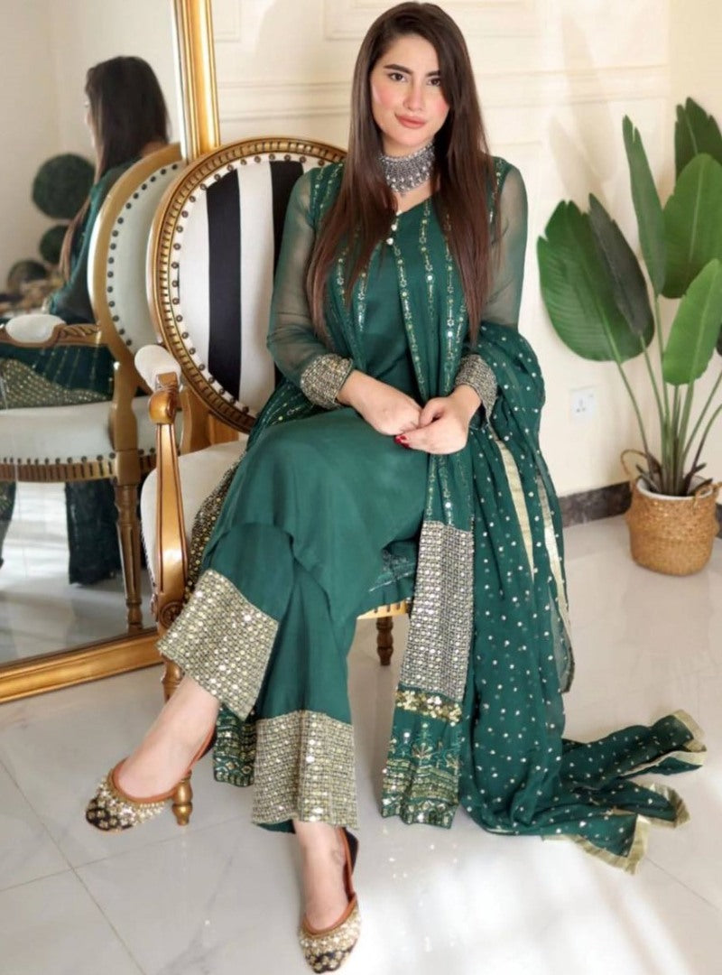 Green heavy embroidery worked salwar suit with shrug