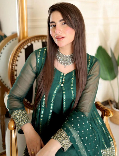 Green heavy embroidery worked salwar suit with shrug