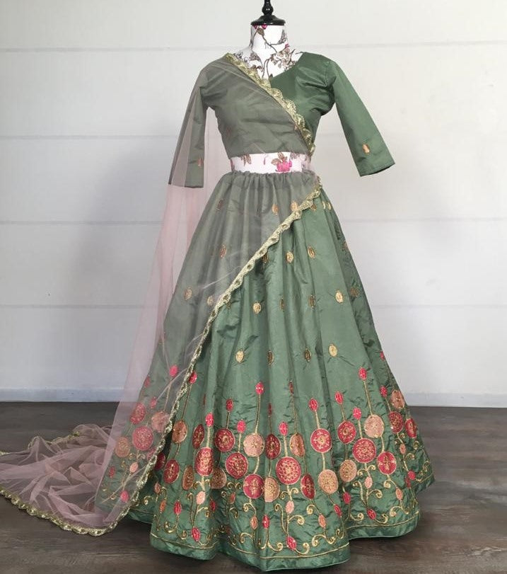 Green kitkat silk embroidered stone work lehenga choli