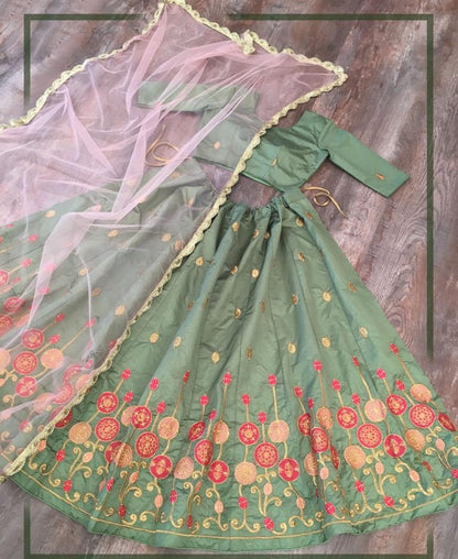Green kitkat silk embroidered stone work lehenga choli