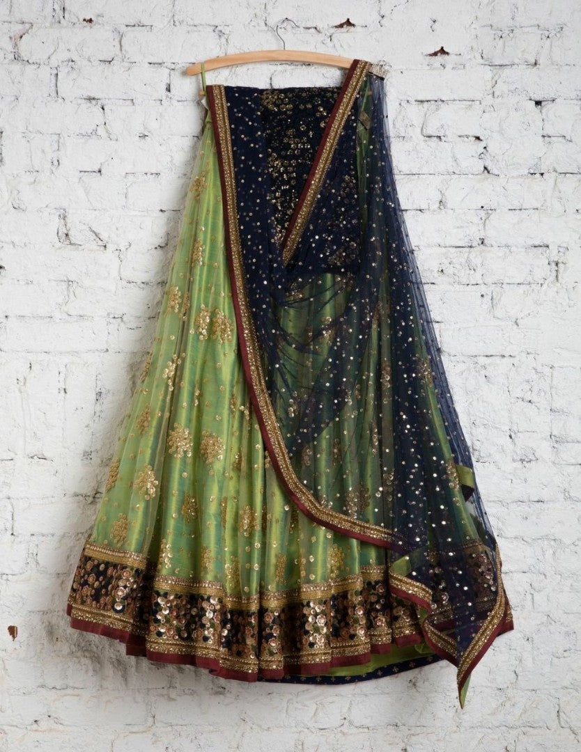 Green net embroidered sequence work wedding lehenga