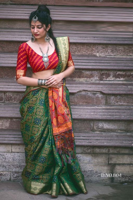 Green patola silk saree with contrast blouse