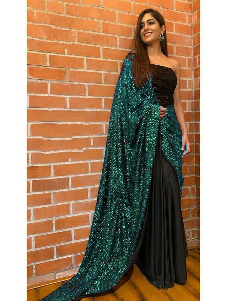 Green sequence work and black half half glamorous saree