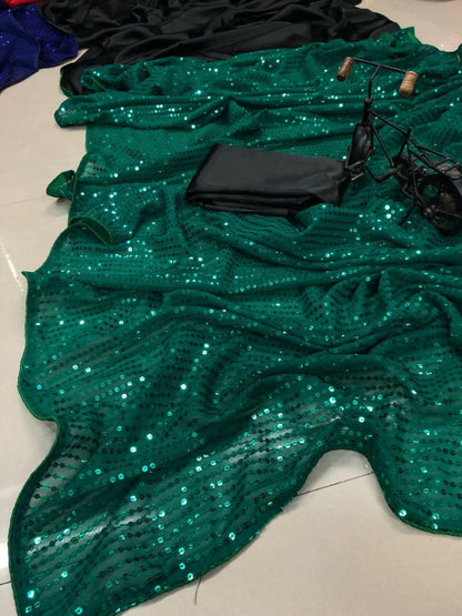 Green sequence work and black half half glamorous saree
