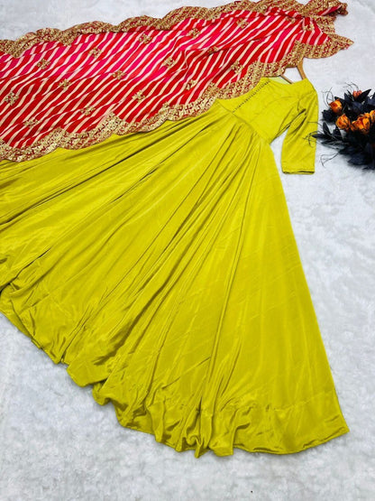 Greenish yellow silk umbrella flair plain gown with printed dupatta