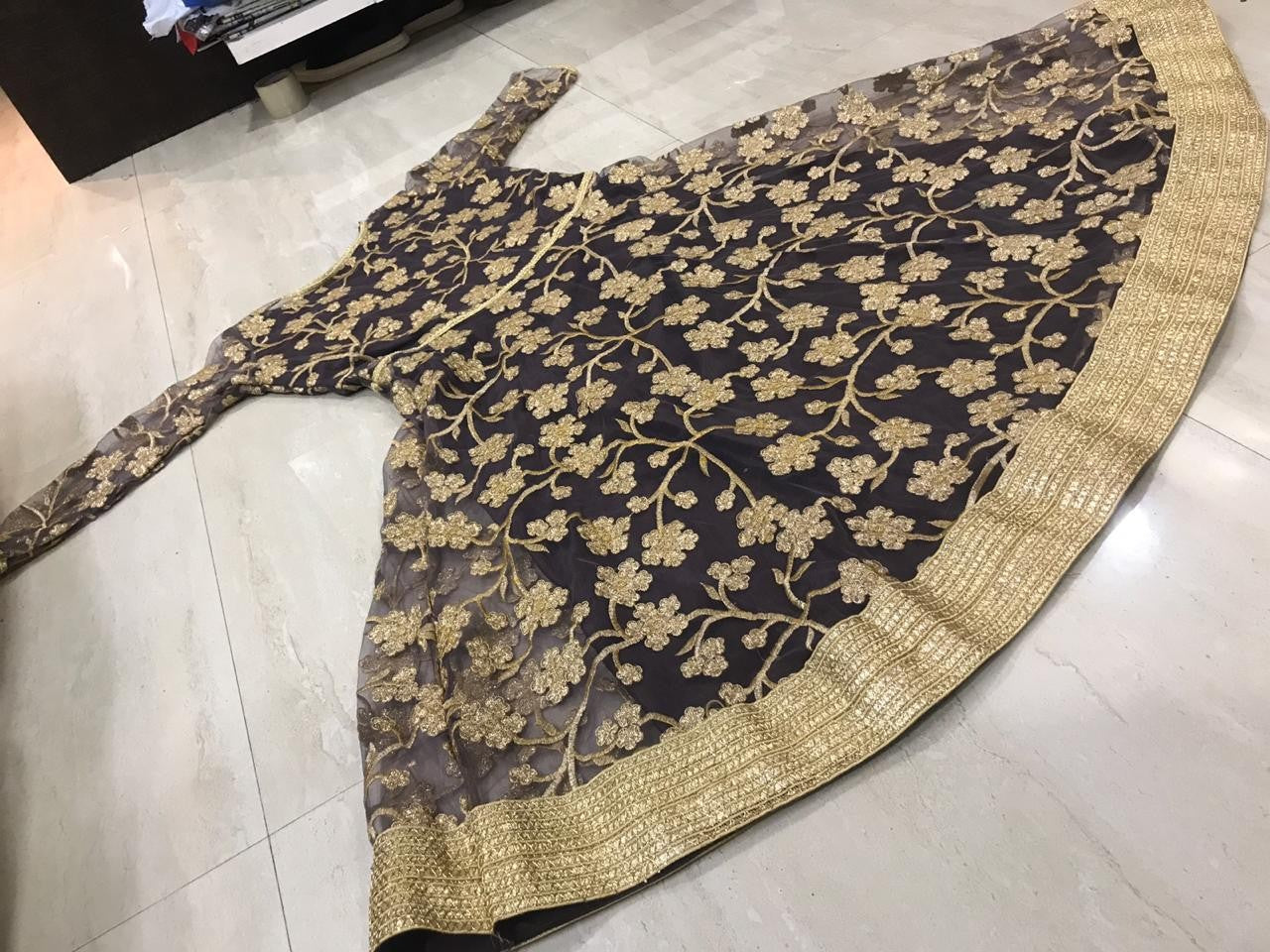 Grey net beautiful embroidered anarkali suit