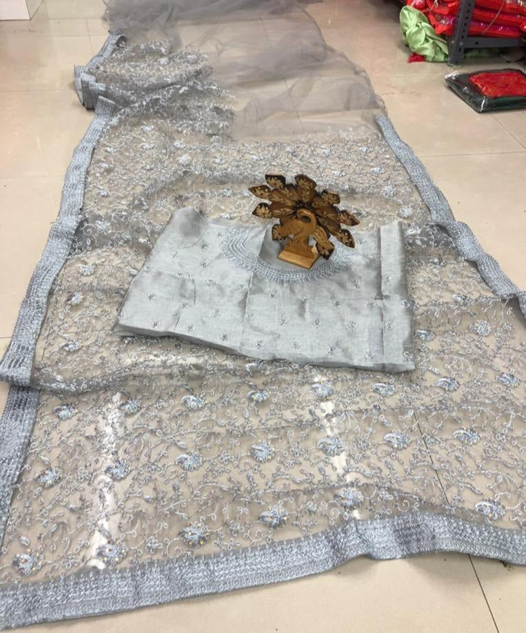 Grey net heavy embroidered and stone work wedding saree
