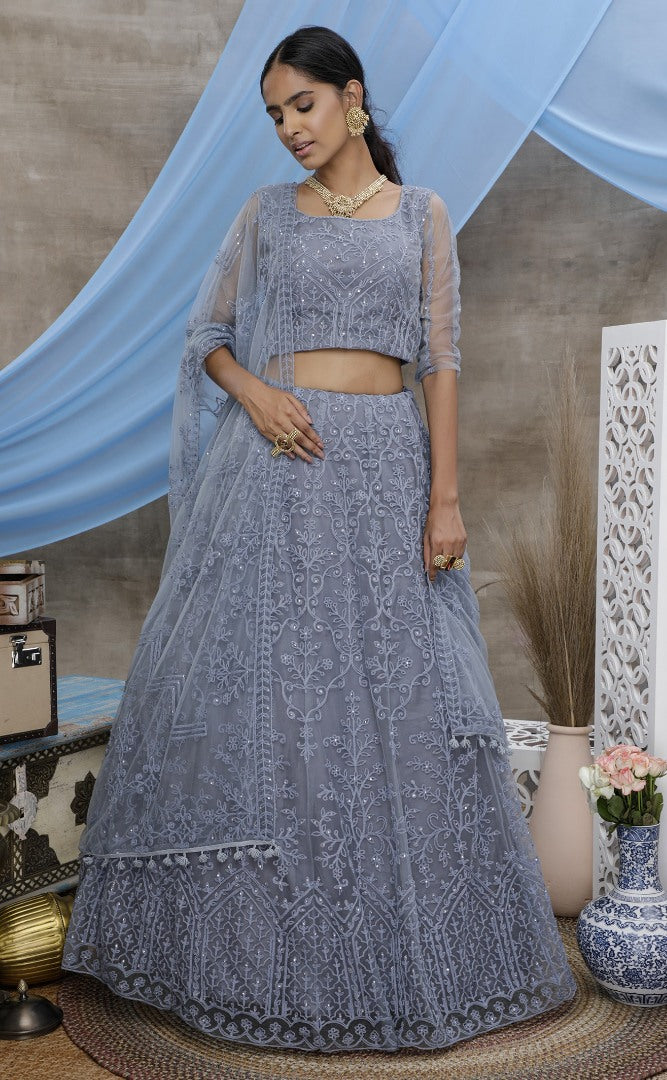 Grey net heavy embroidered stone pasting wedding lehenga choli