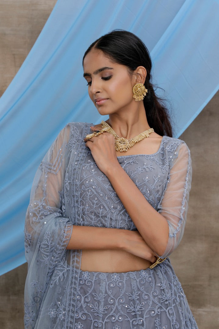 Grey net heavy embroidered stone pasting wedding lehenga choli