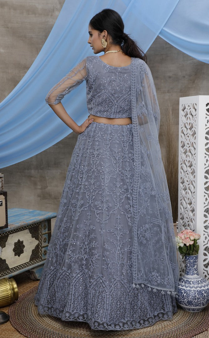 Grey net heavy embroidered stone pasting wedding lehenga choli