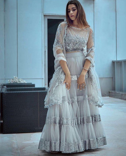 Grey net sequence worked ceremonial lehenga choli