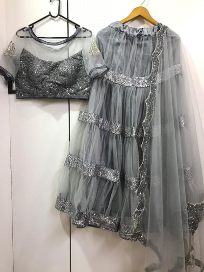 Grey net sequence worked ceremonial lehenga choli