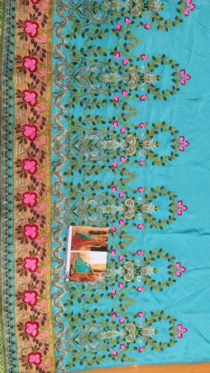 heavy embroidered orange and rama half wedding saree