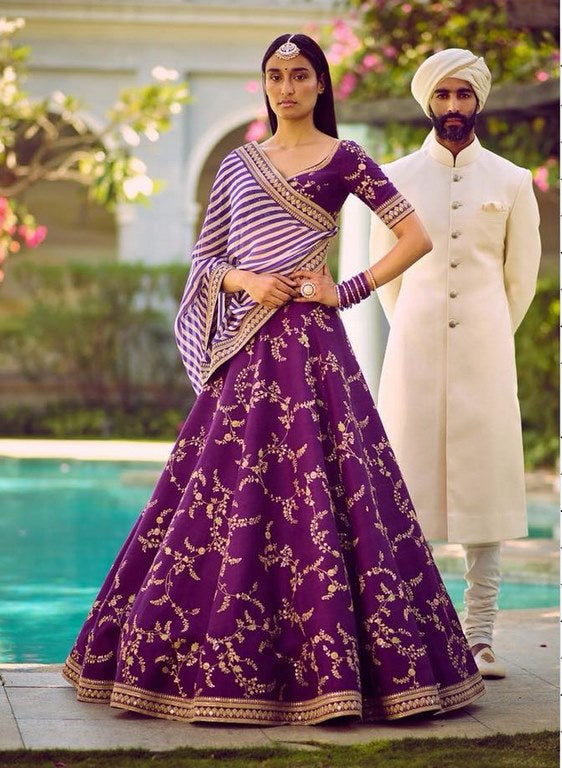 Heavy embroidered violet phantom silk bridal wedding lehenga