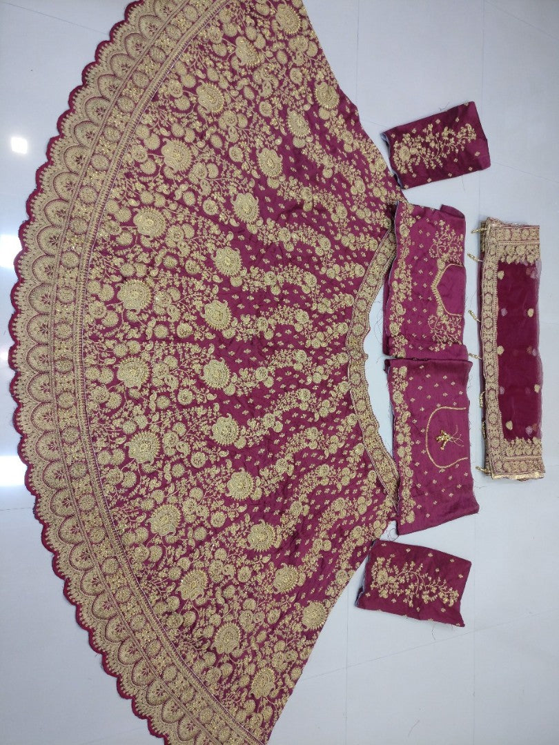 Heavy maroon phantom silk embroidered bridal lehenga