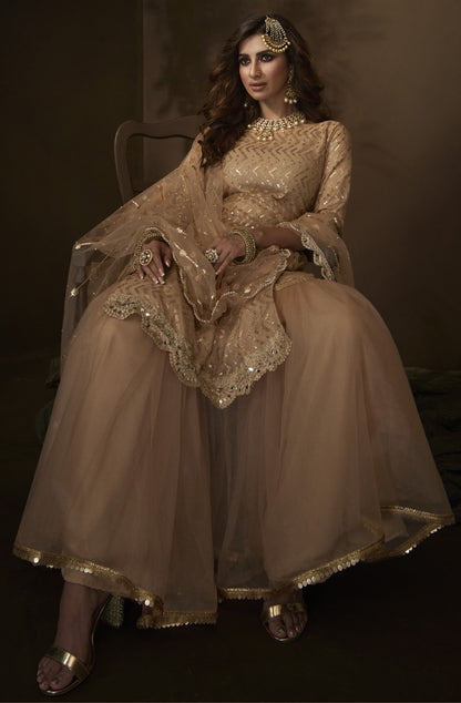 Light brown soft net sequence work ceremonial sharara salwar suit