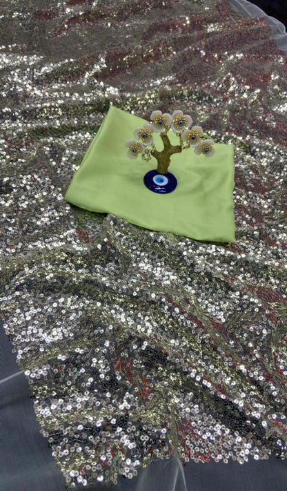 Light green heavy nylon net all over sequence work saree