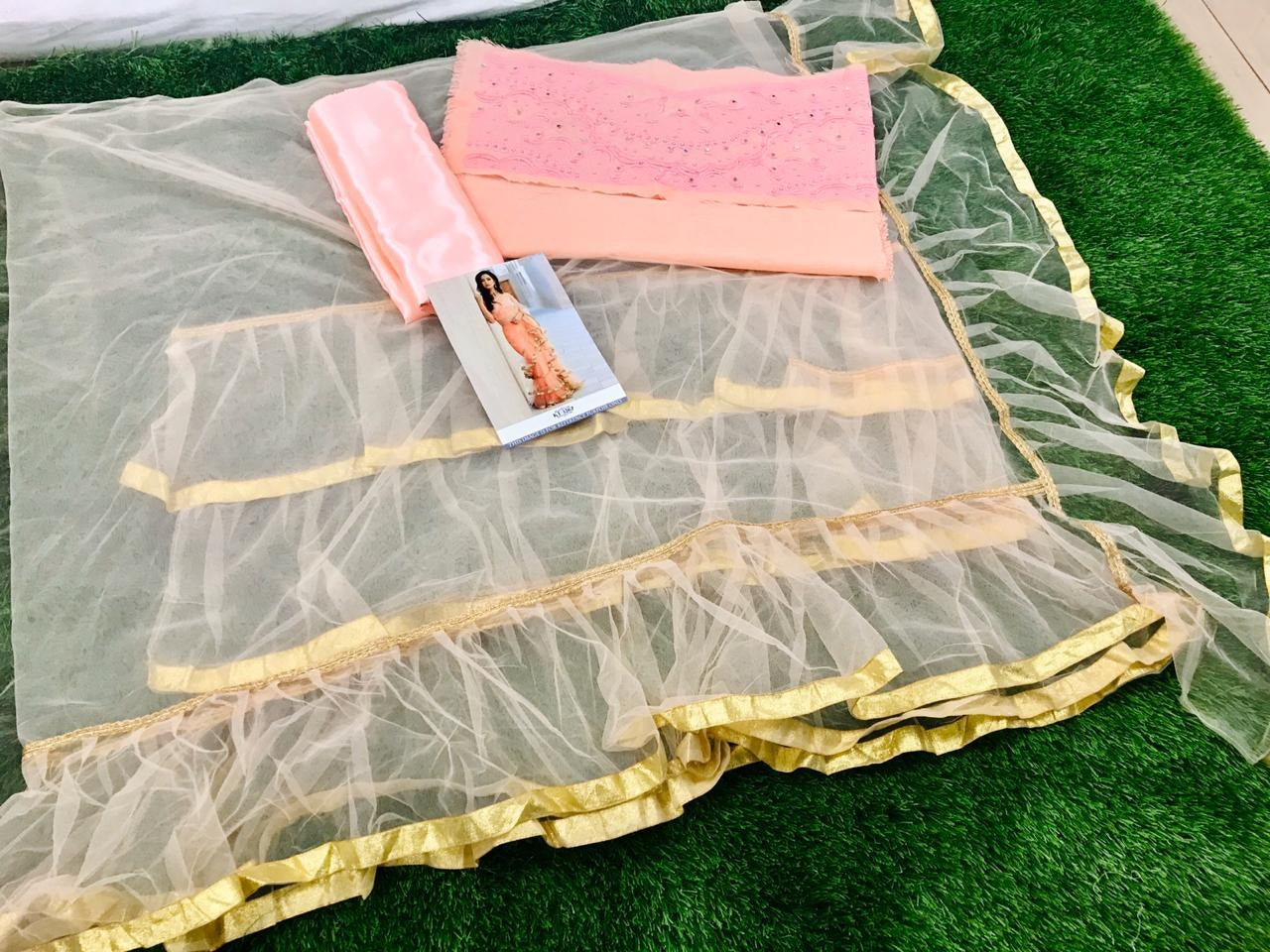 Light orange mono net multi ruffle ceremonial saree