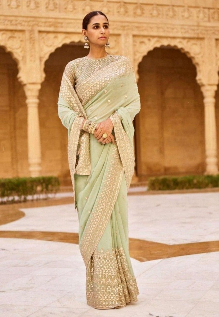 Light pista rangoli silk embroidery work wedding saree