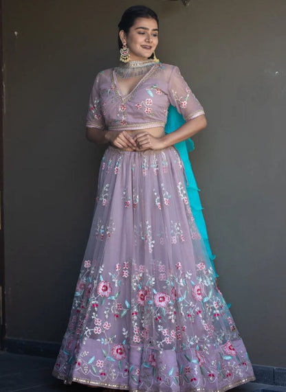 Light purple net heavy embroidered wedding lehenga choli