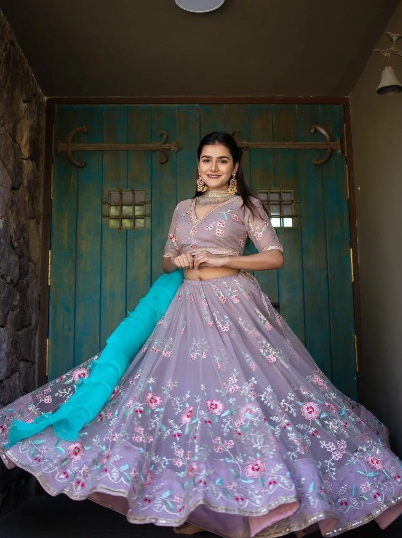 Light purple net heavy embroidered wedding lehenga choli