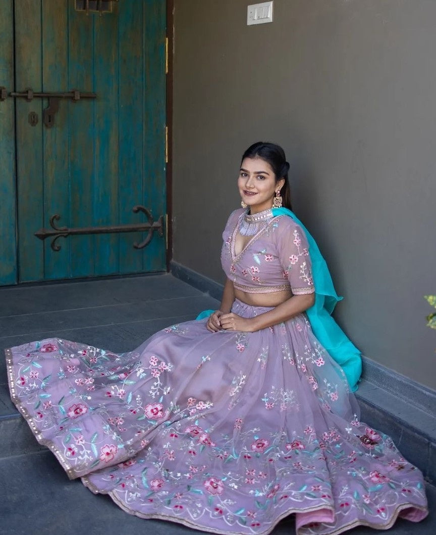 Light purple net heavy embroidered wedding lehenga choli