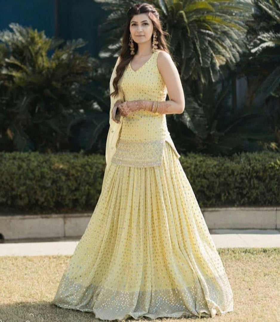 Light yellow georgette embroidered sequence work ceremonial lehenga choli