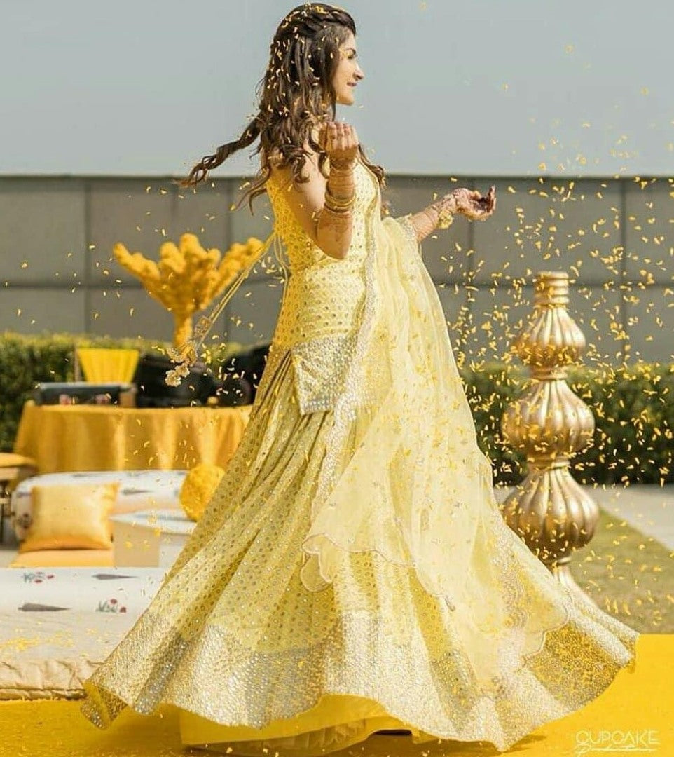 Light yellow georgette embroidered sequence work ceremonial lehenga choli
