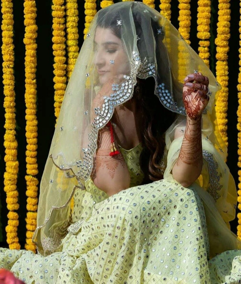 Light yellow georgette embroidered sequence work ceremonial lehenga choli